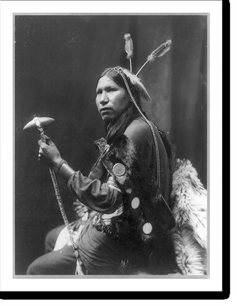 Historic Framed Print, [Afraid of Hawk, three-quarter length portrait, seated, facing left; holding tomahawk], 17-7/8