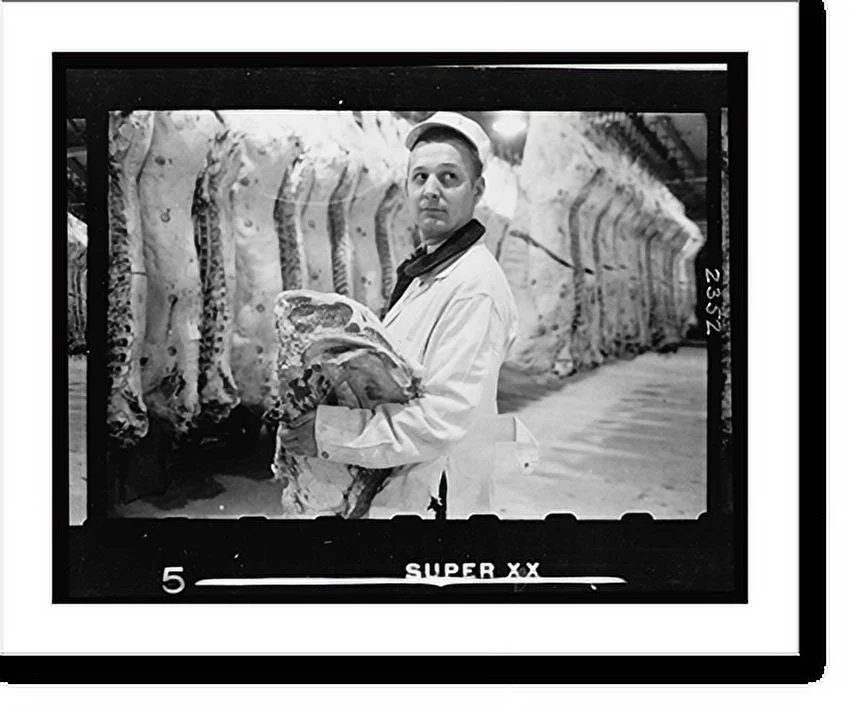 Historic Framed Print, [Butcher holding slab of beef in a meat locker], 17-7/8" x 21-7/8"