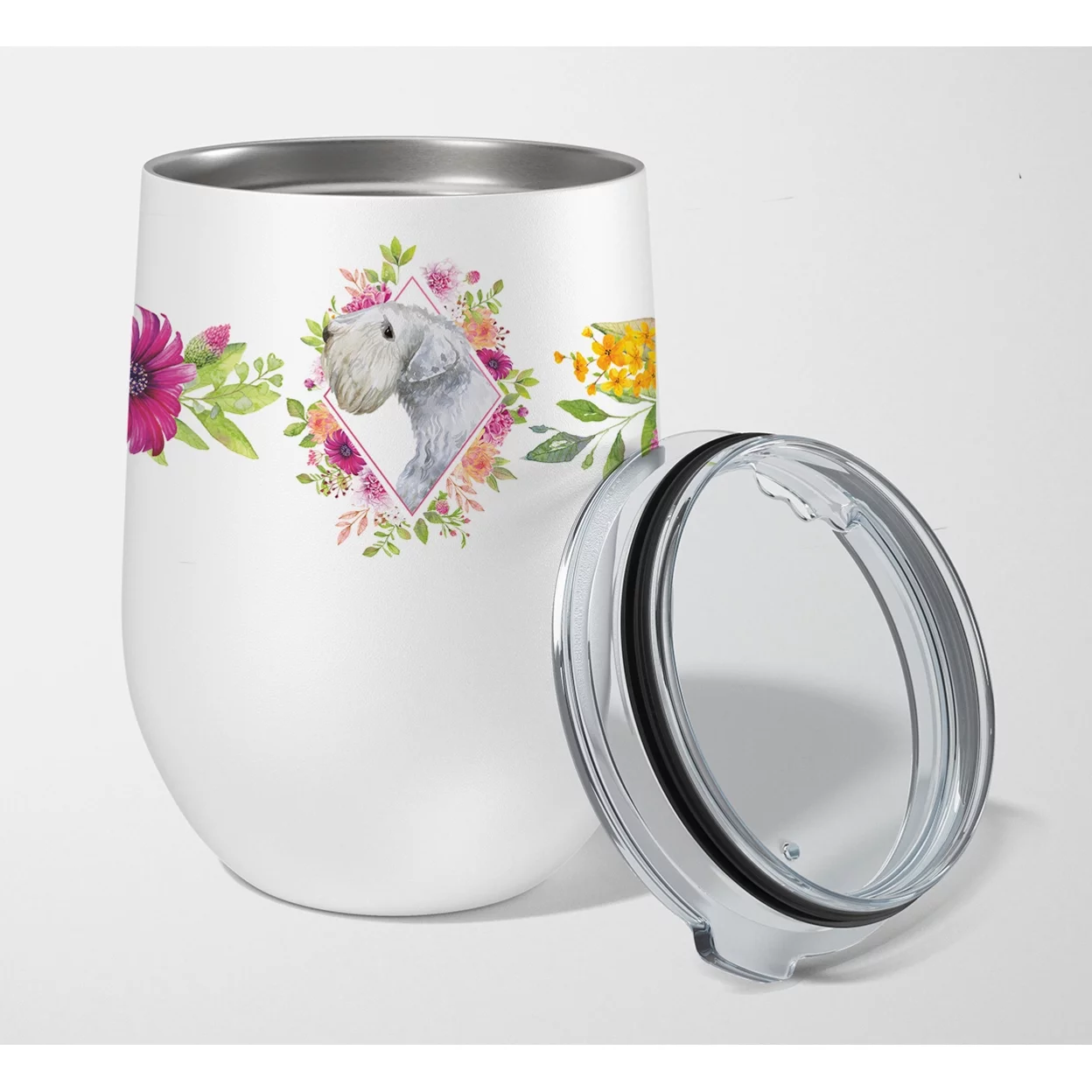 Carolines Treasures CK4180TBL12 Sealyham Terrier Pink Flowers Stainless Steel 12 oz Stemless Wine Glass 12 oz multicolor