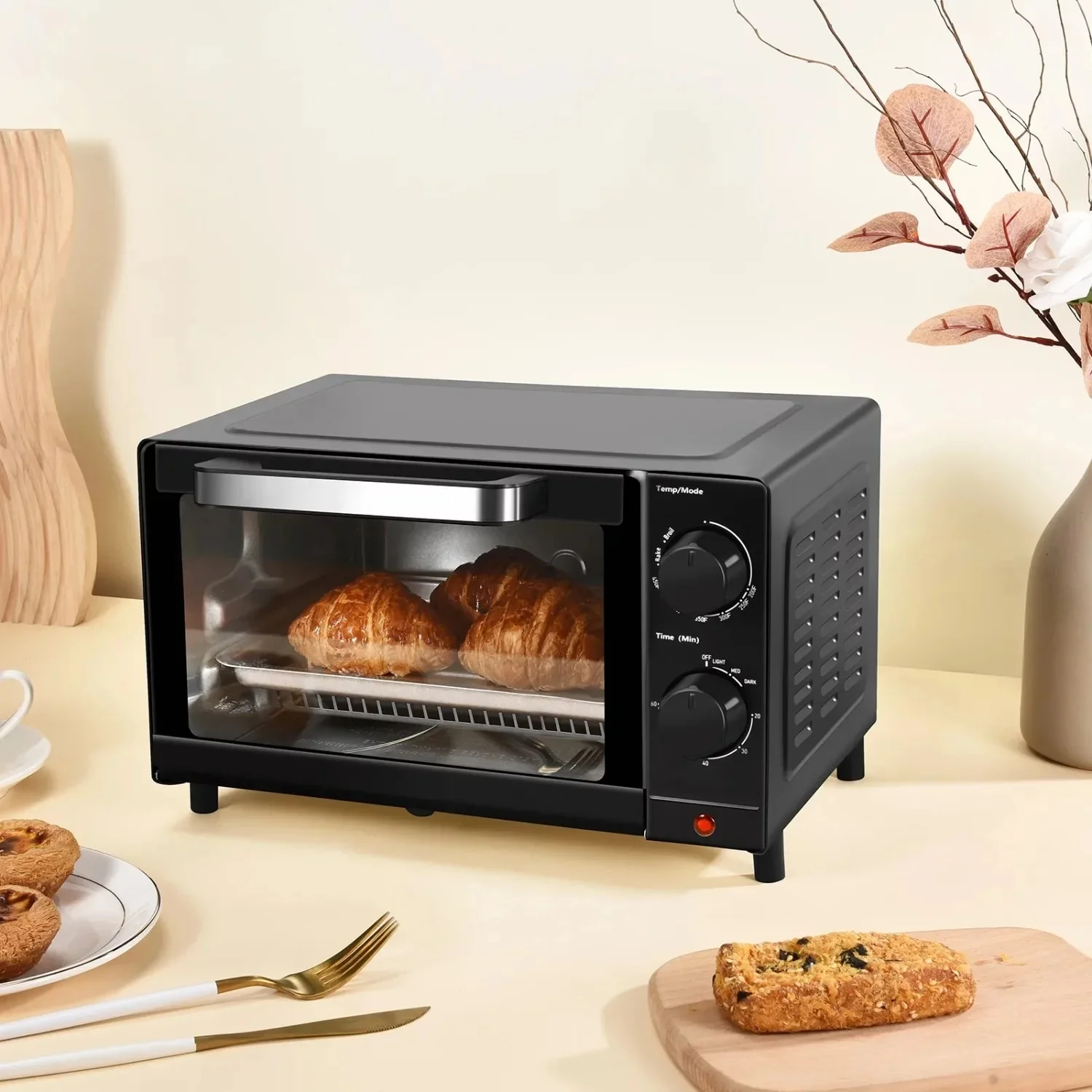 Versatile 4-Slice Toaster Oven: 3 Settings, Baking Rack, and Pan in Sleek Black Design