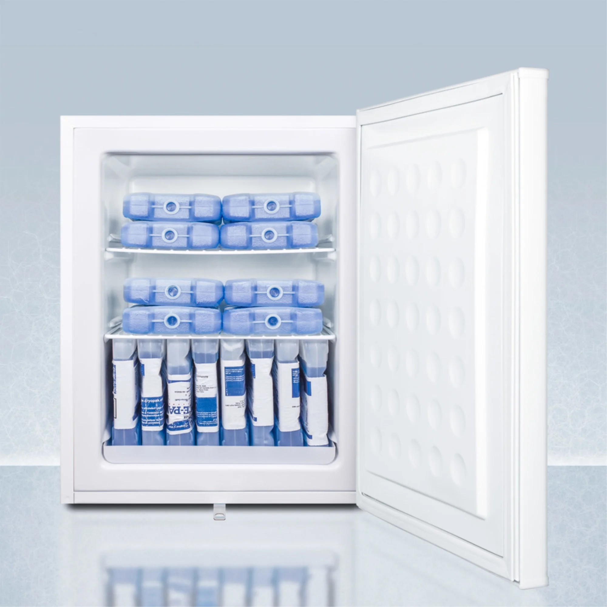 Compact manual defrost all-freezer with lock and probe hole