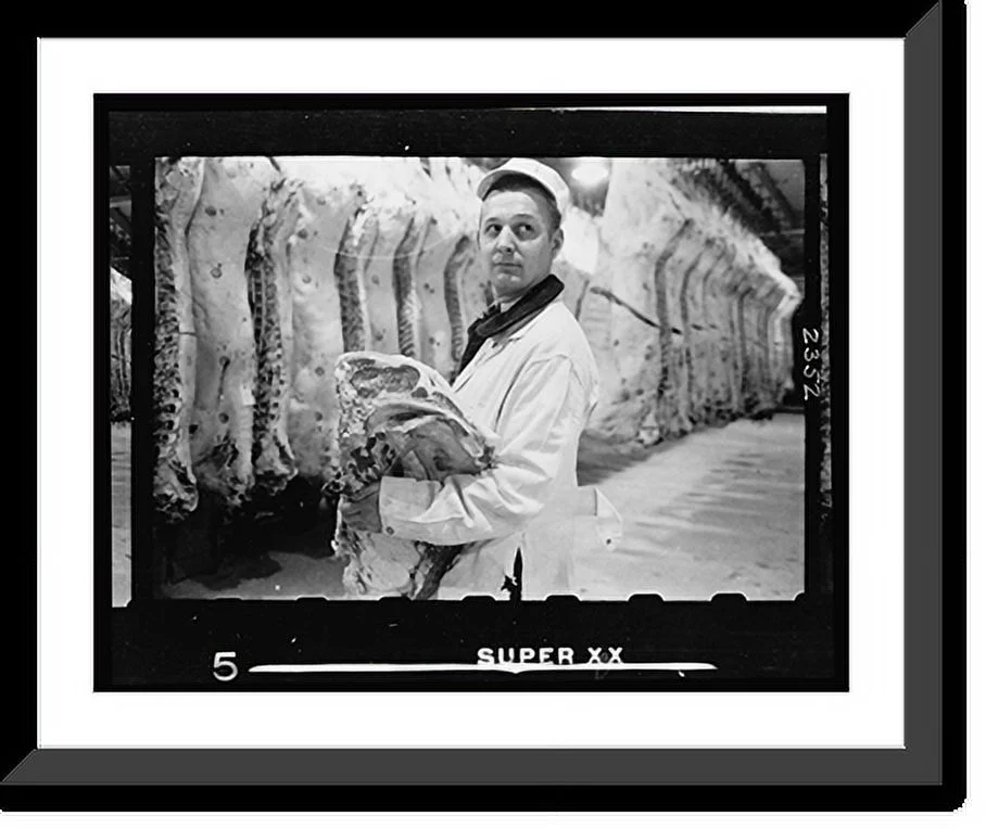 Historic Framed Print, [Butcher holding slab of beef in a meat locker], 17-7/8" x 21-7/8"