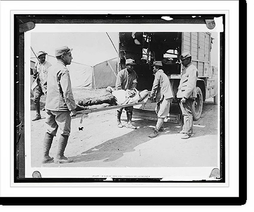 Historic Framed Print, [Wounded man on ambulance stretcher], 17-7/8