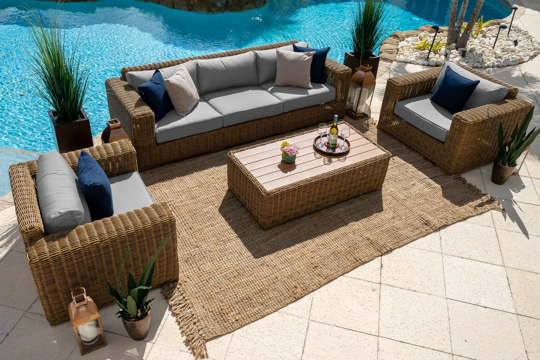 Malmo 4-Piece Resin Wicker Outdoor Patio Furniture Conversation Sofa Set (L) In Natural w/ Sofa, Two Armchairs, and Coffee Table (Full-Round Natural Wicker, Polyester Light Gray)