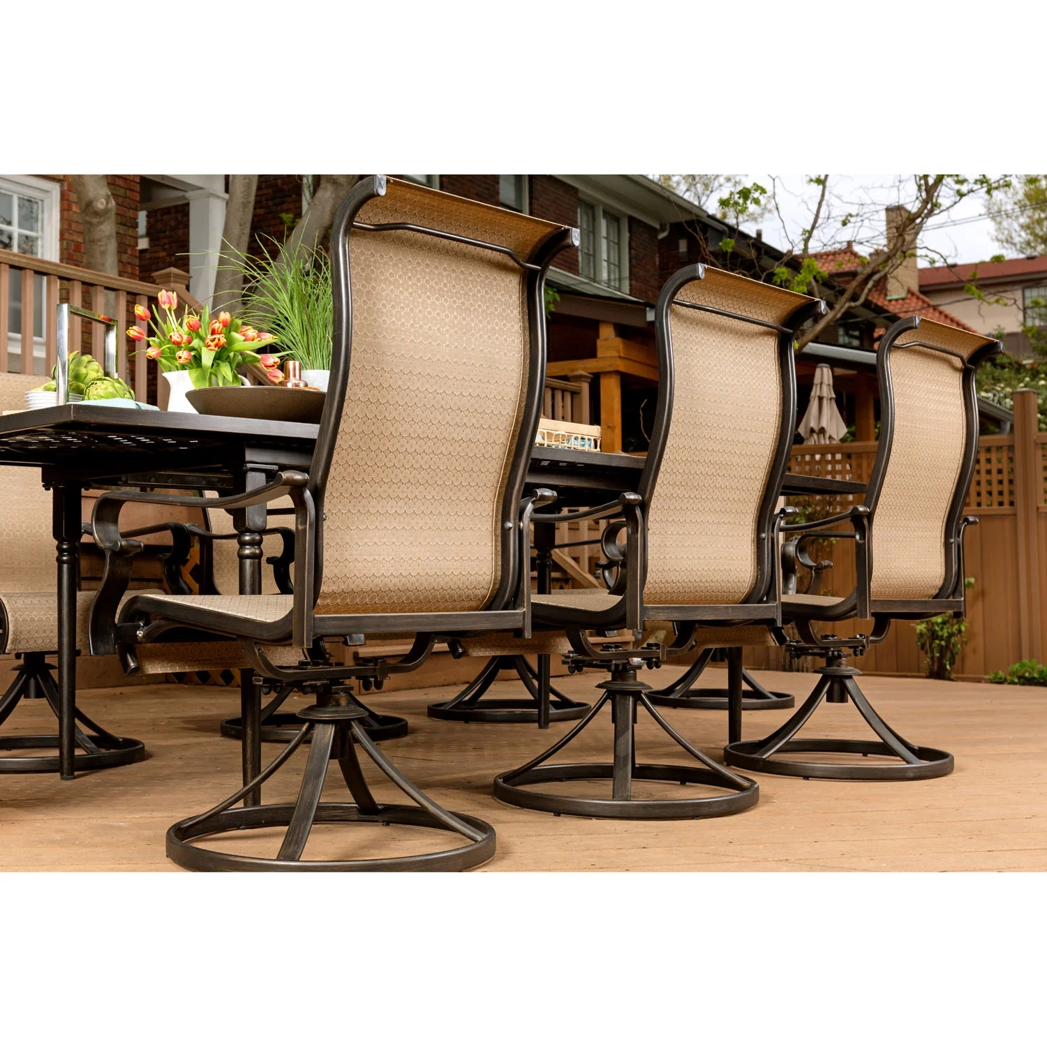 Hanover Brigantine 9-Piece Dining Set with an Expandable Cast-Top Dining Table and 8 Sling Swivel Rockers