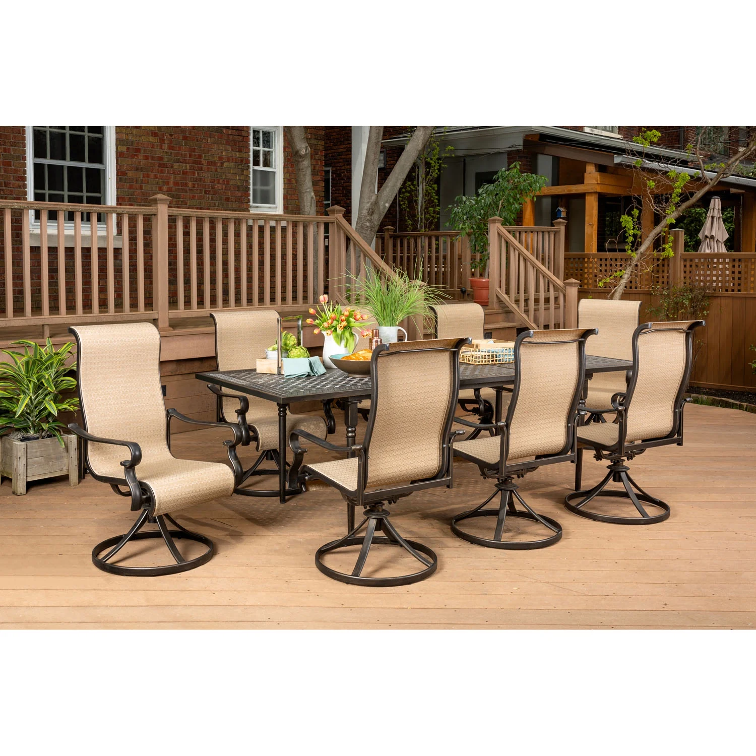 Hanover Brigantine 9-Piece Dining Set with an Expandable Cast-Top Dining Table and 8 Sling Swivel Rockers