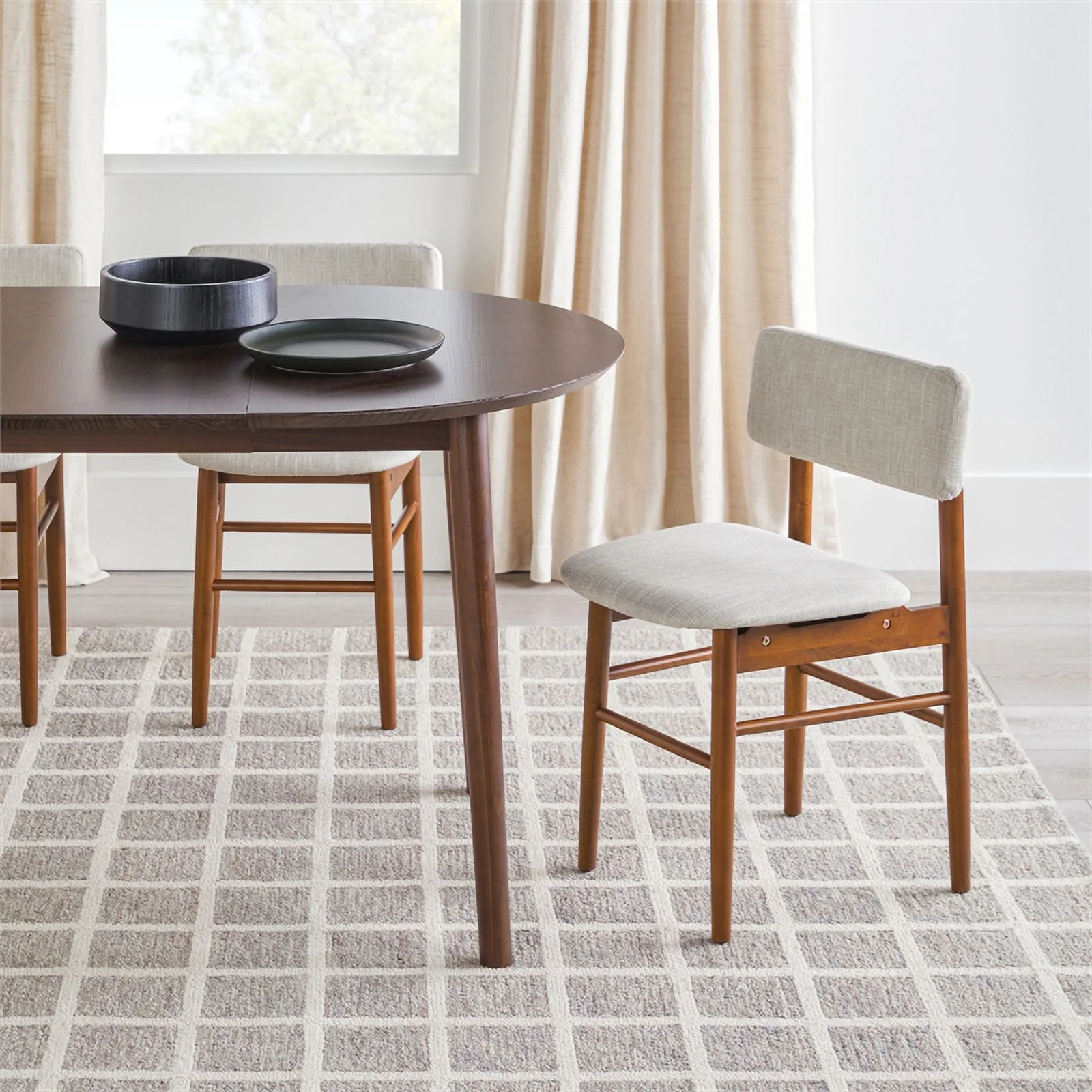 Pemberly Row Oval Solid Wood Dining Table with Removable Leaf in Walnut